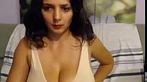 Brunette revealing her huge natural tits